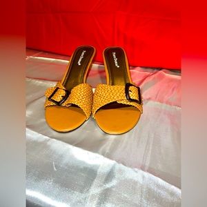 Brown candy heel shoe.